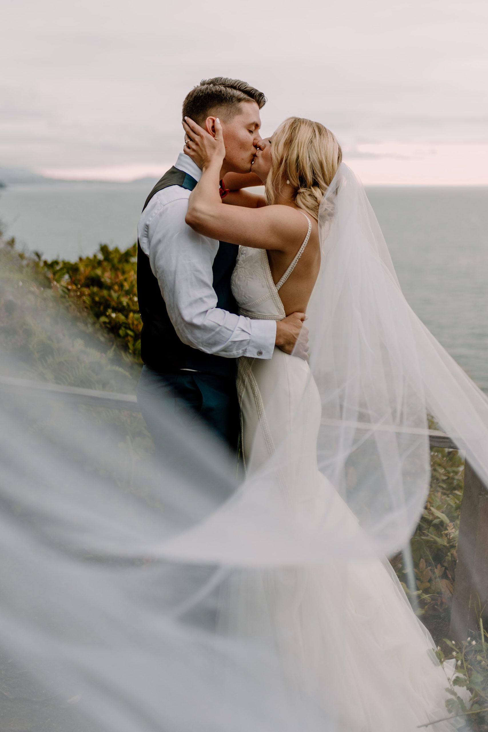 Birman Visuals Oceanside Wedding Couple Kissing Long Veil PNW Weddings