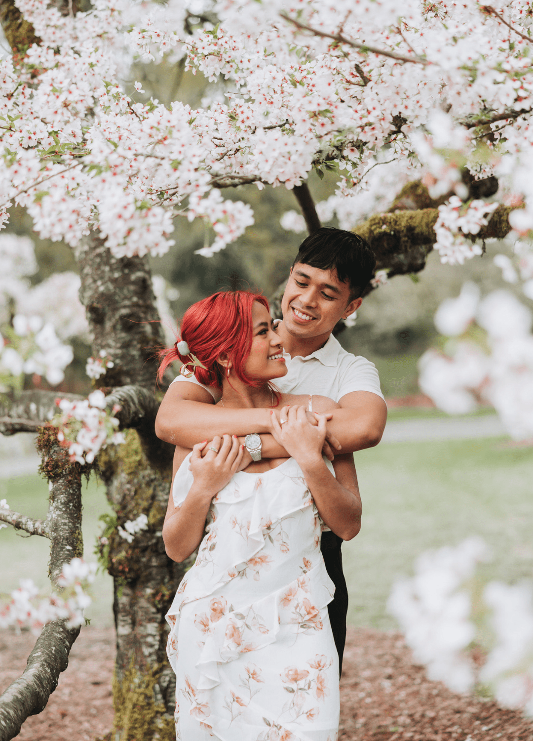 Jonathan Tung Photography - PNW Weddings - Photographer - Washington - Red Hair Cherry Blossoms Elopement City Park Floral Dress Ruffles Embrace Asian Couple-min